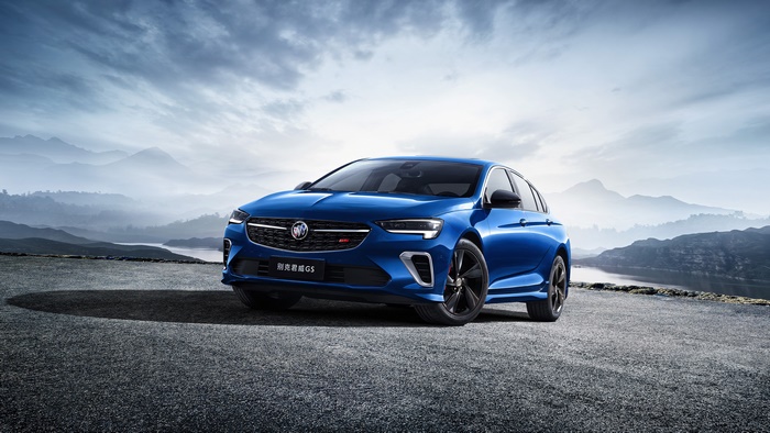 Blue Buick Regal GS 4K on a mountain road