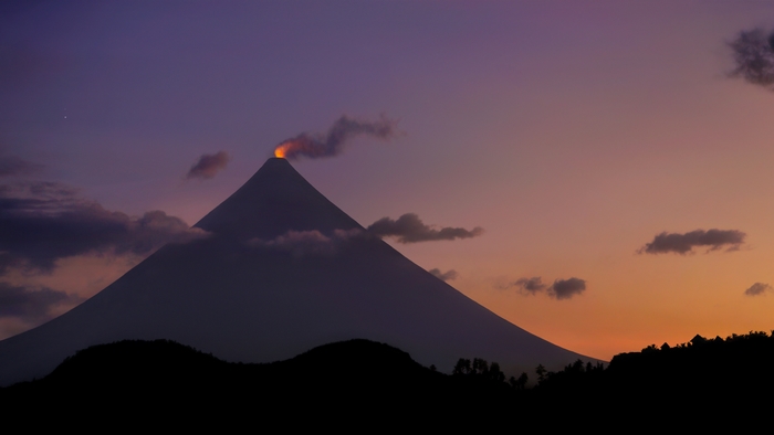 Mount Mayon Volcano Smoking at Sunset, Philippines