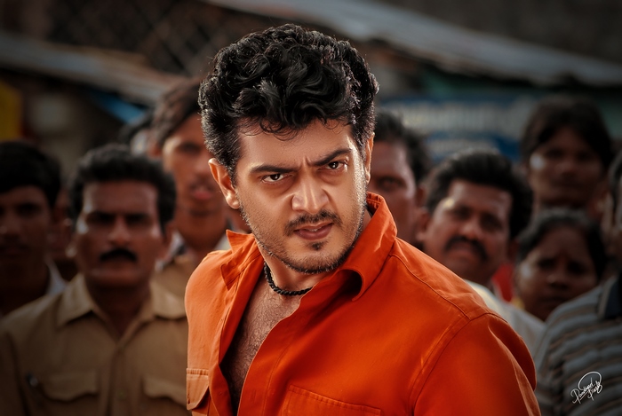 Intense Ajith Kumar in orange shirt from Aalwar