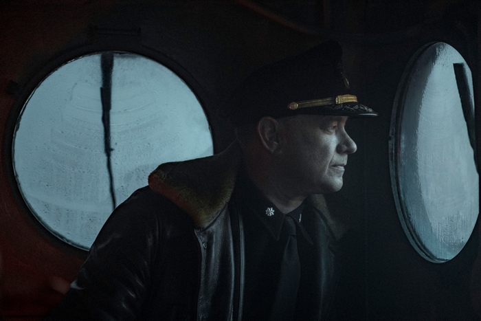 Tom Hanks as Captain Krause looking out porthole in Greyhound