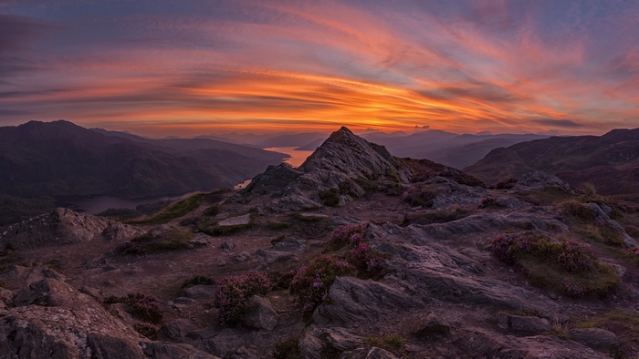 Fiery Sunset Over Mountain Peak and Lake