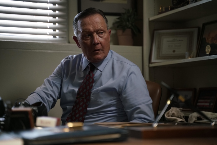 Robert Patrick in No Man Of God sitting at desk