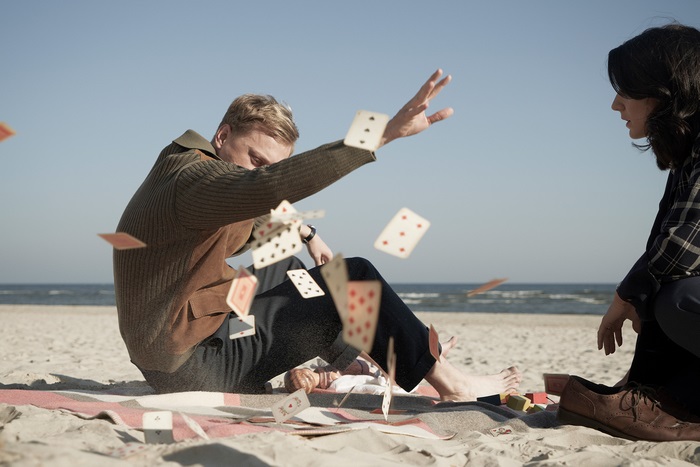 Adventures Of A Mathematician: Man throwing cards on beach