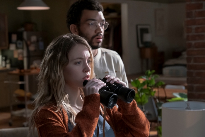 Sydney Sweeney and Justice Smith observing in The Voyeurs