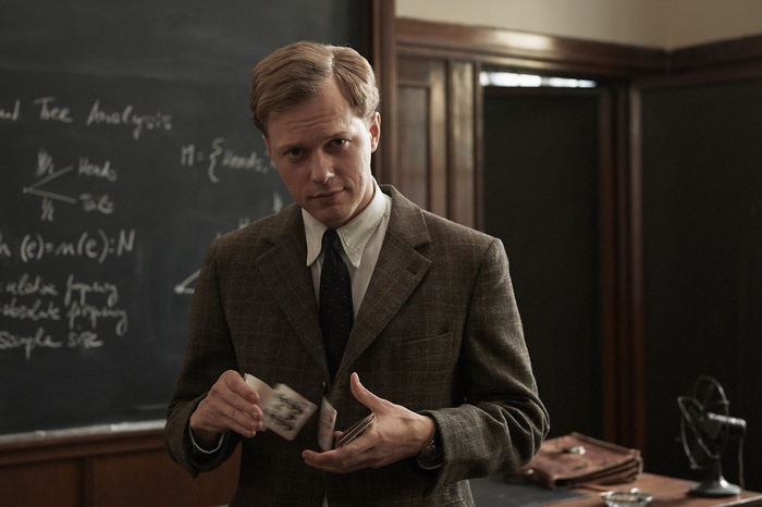 Philippe Tlokinski in Adventures Of A Mathematician holding cards