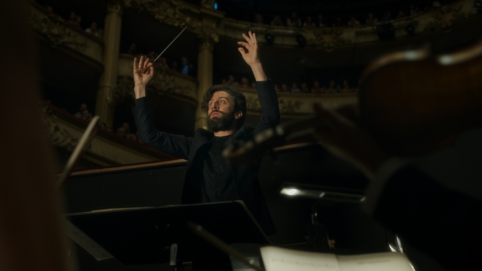 Simon Helberg conducting an orchestra in Annette