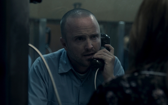 Aaron Paul talking on phone in Truth Be Told