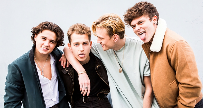 The Vamps band members posing playfully