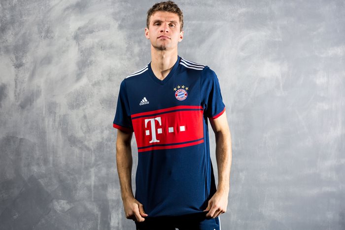 Thomas Müller poses in FC Bayern Munich jersey