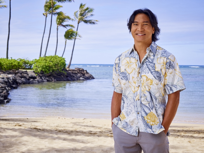 Doogie Kamealoha, M.D. actor smiling on a tropical beach