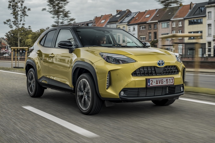 Yellow Toyota Yaris Cross Hybrid Elegant SUV driving