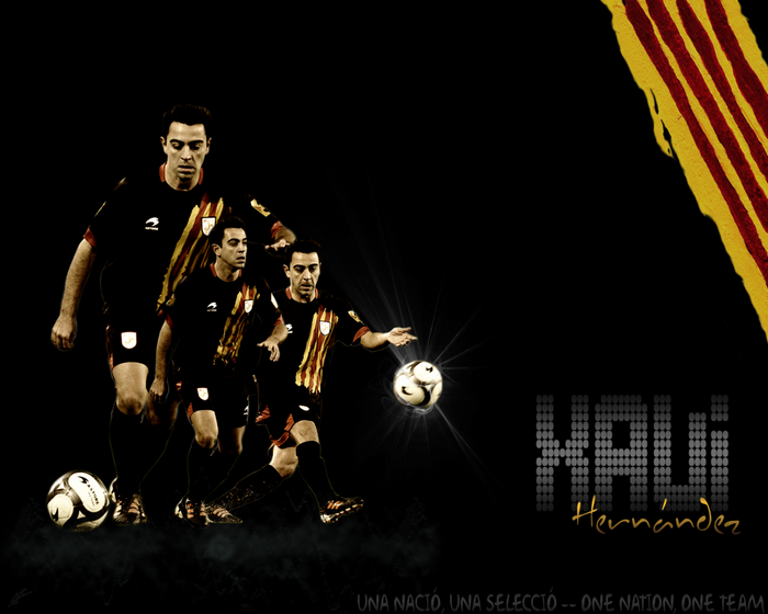 Xavi Hernández playing soccer with Catalan flag