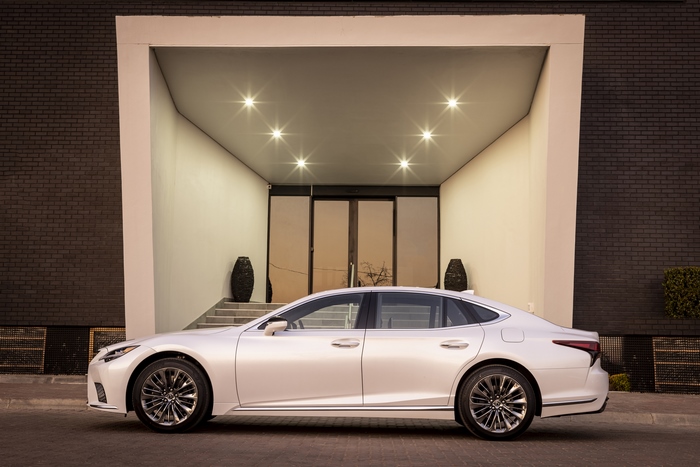 Elegant Lexus LS 500 luxury car at illuminated entrance
