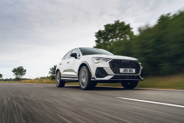 White Audi Q3 Sportback S Line luxury SUV driving
