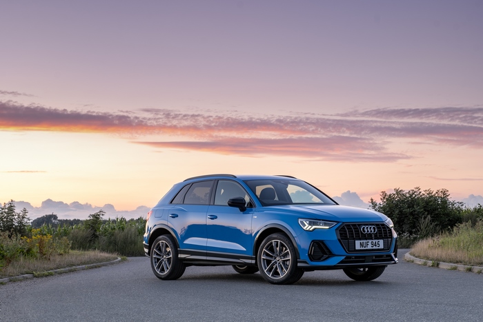 Blue Audi Q3 SUV at sunset