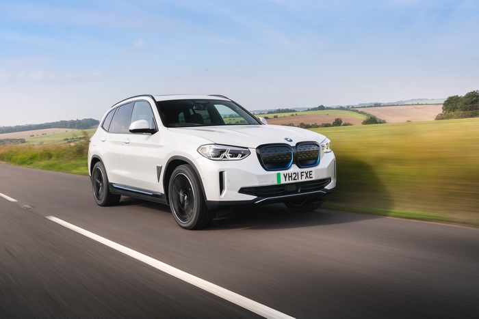 White BMW iX3 electric SUV in motion