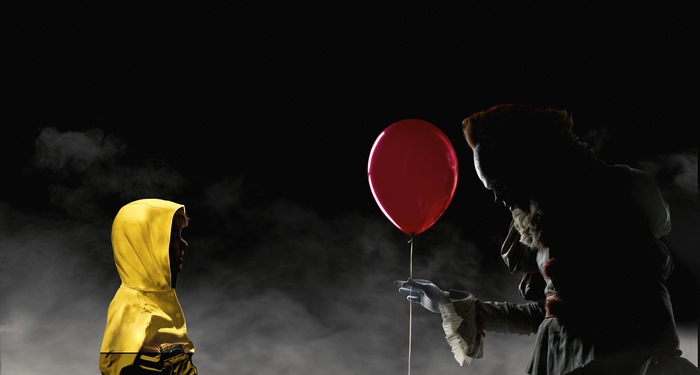 Pennywise offers red balloon to Georgie in It (2017)
