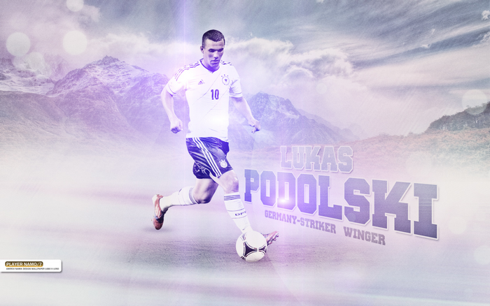 Lukas Podolski Germany striker dribbling football in mountains