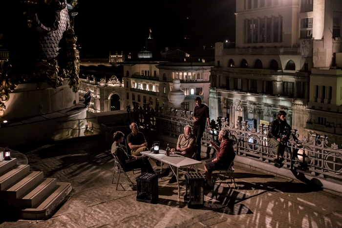 The Vault (2021) cast on a city rooftop at night