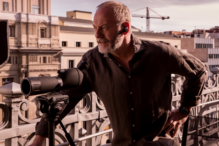 Liam Cunningham observing with a spotting scope in The Vault
