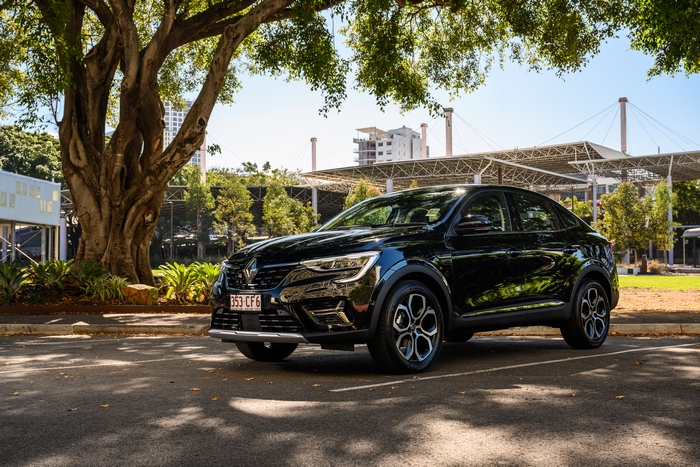 Black Renault Arkana SUV parked under a tree
