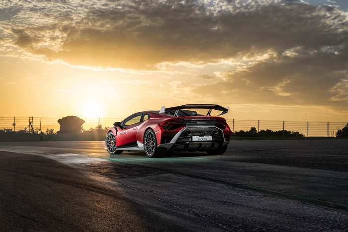 Red Lamborghini Huracán STO supercar at sunset