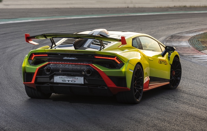 Green and yellow Lamborghini Huracán STO on race track