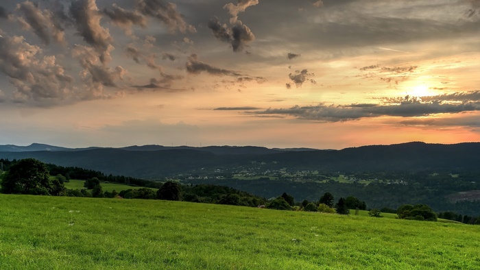 Golden Sunset over Lush Green Hills and Valley