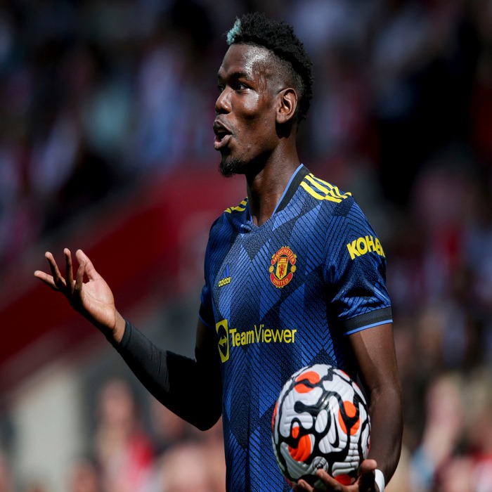 Paul Pogba in Manchester United jersey holding a football