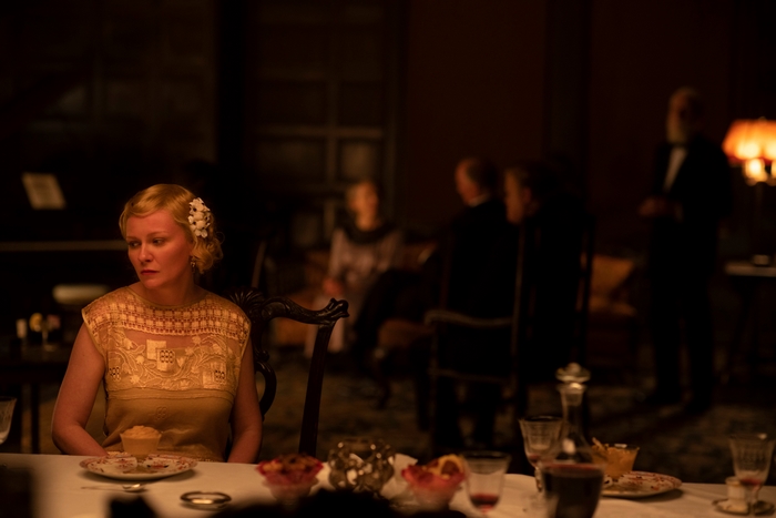 Kirsten Dunst pensive at dinner in The Power of the Dog