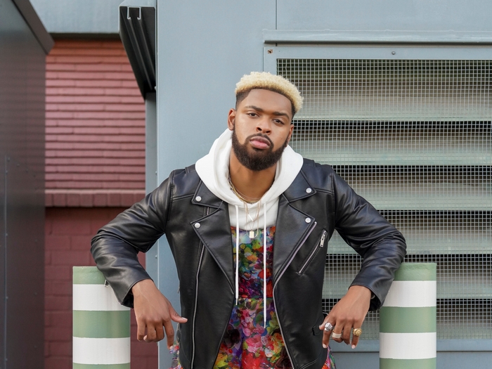 Warren Egypt Franklin in black leather jacket and hoodie