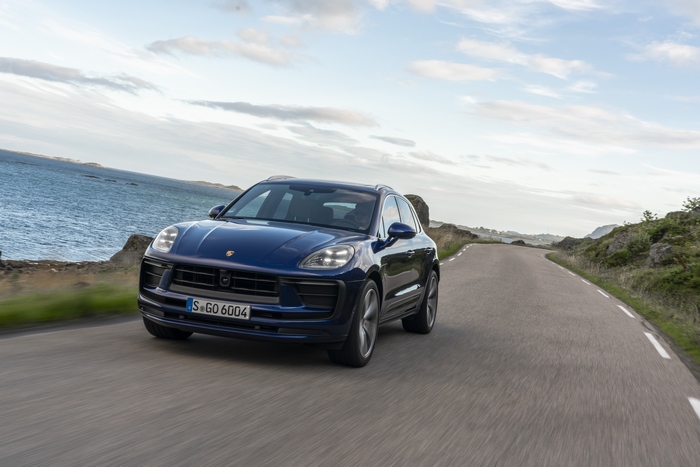Luxury Blue Porsche Macan SUV on a coastal road