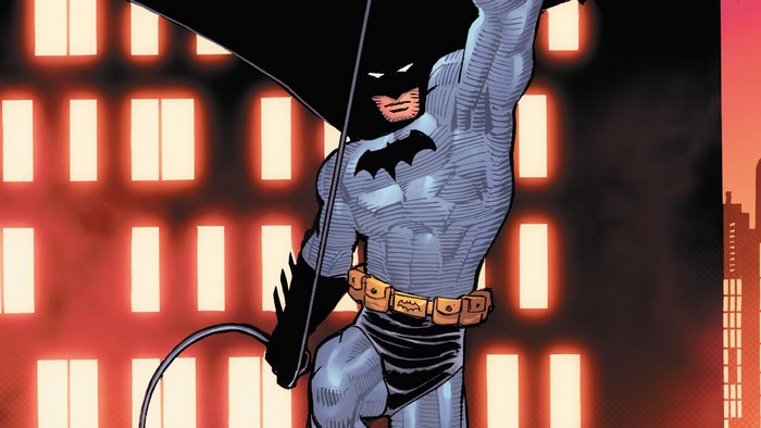 Batman with Grappling Hook Against Glowing City Windows