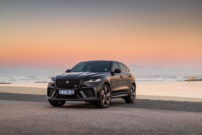 Black Jaguar F-Pace SVR SUV at sunset on the beach