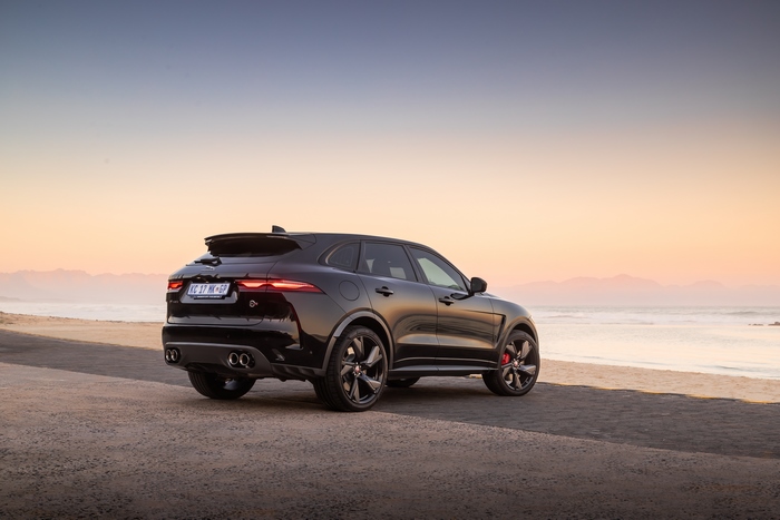 Black Jaguar F-Pace SVR SUV at sunset beach