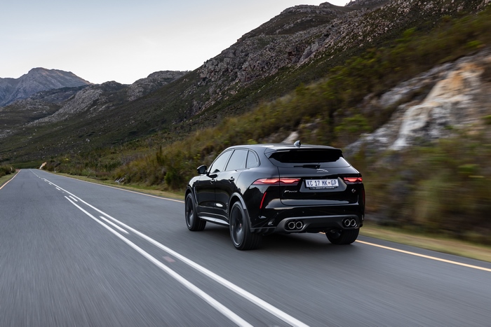 Black Jaguar F-Pace SVR SUV driving on mountain road