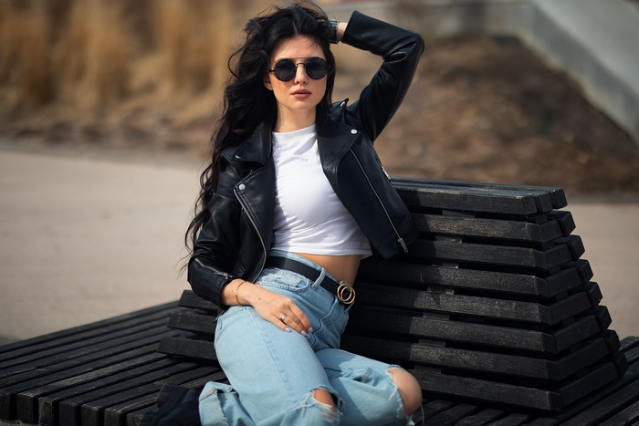 Woman in Leather Jacket and Sunglasses