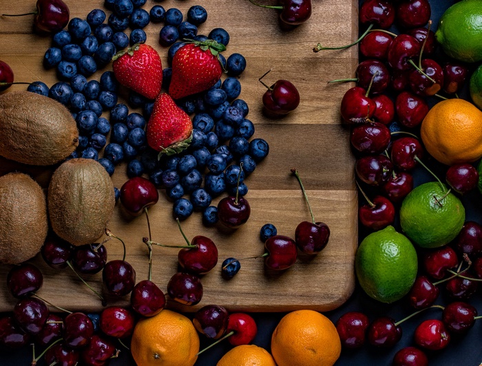 Colorful Fresh Berries, Kiwis, and Citrus Fruits