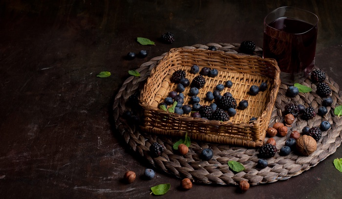 Rustic Still Life with Berries, Nuts, and Juice