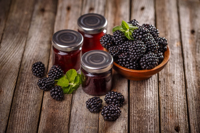 Homemade Blackberry Jam with Fresh Berries on Wood