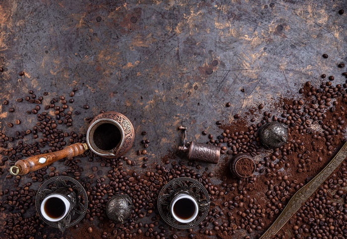 Traditional coffee beans, cups, and brewing tools