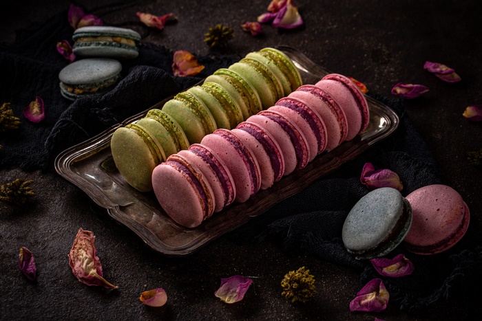Colorful Macarons on Silver Tray with Rose Petals