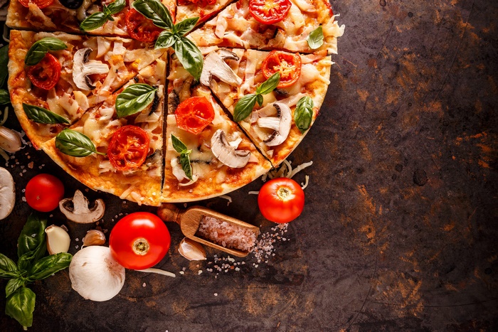 Delicious Pizza with Fresh Tomatoes, Mushrooms, and Basil