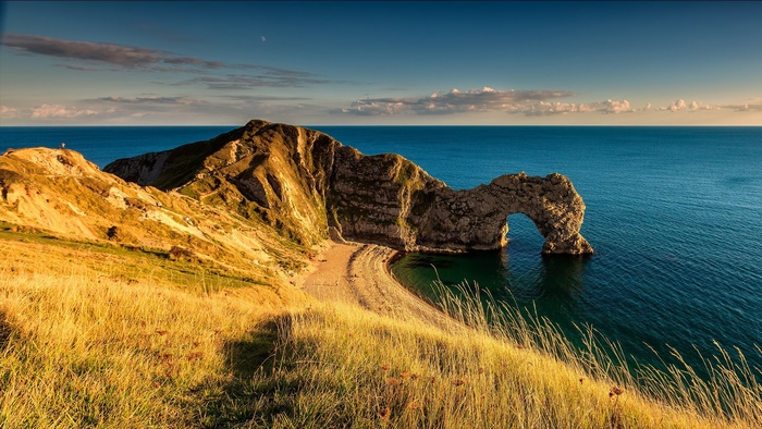 Golden Durdle Door Arch on the Coast at Sunset