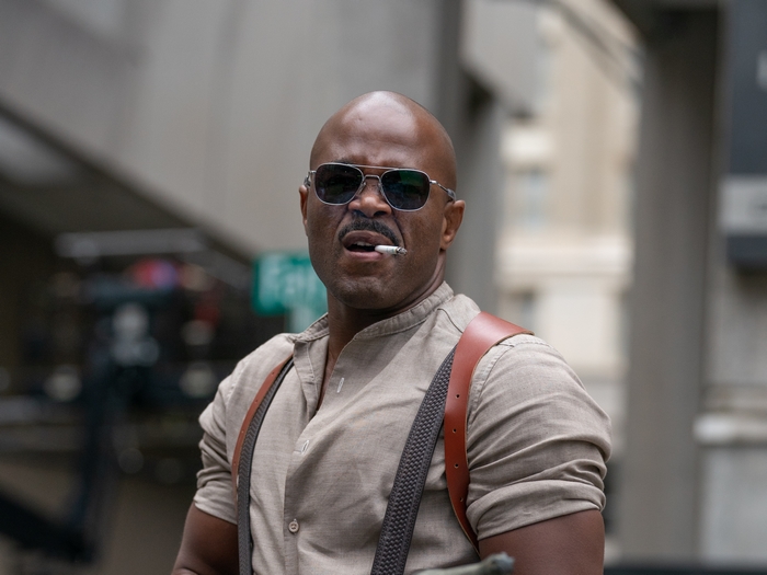 Rashad Evans in Boss Level with sunglasses and cigarette
