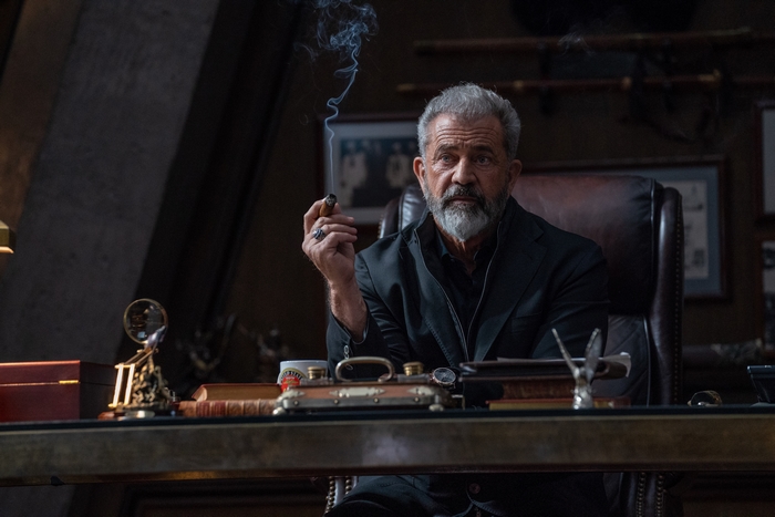 Mel Gibson smoking a cigar, Boss Level