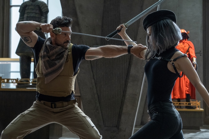 Frank Grillo and Selina Lo in sword fight