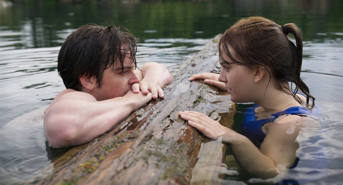 Emilia Jones and man share a moment in CODA