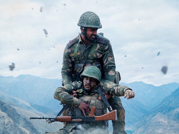 Sidharth Malhotra in Shershaah, rescuing a fellow soldier