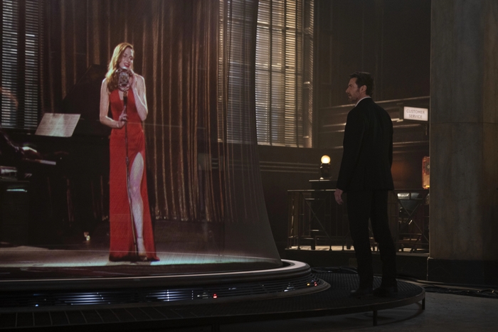 Hugh Jackman watches a holographic singer in Reminiscence